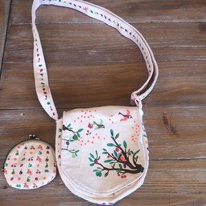 Child’s adjustable fabric purse with coin purse.